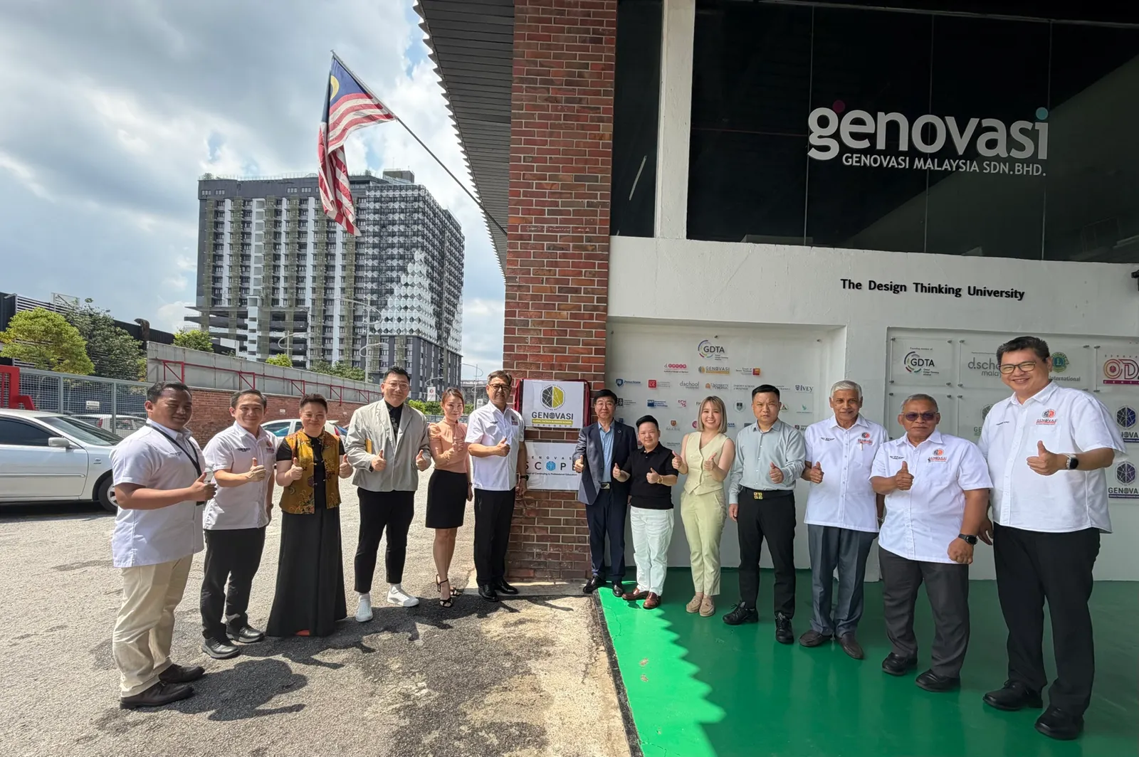Group photograph outside Genovasi on the day the New Finance Business School was inaugurated